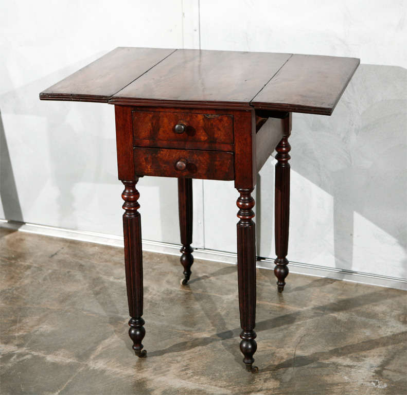 A very nice smaller American two flap table, circa 1835. This is a good example of the Federal period and it will stand in good steed in your period setting.When leaves are up the width is then 26 7/8". 