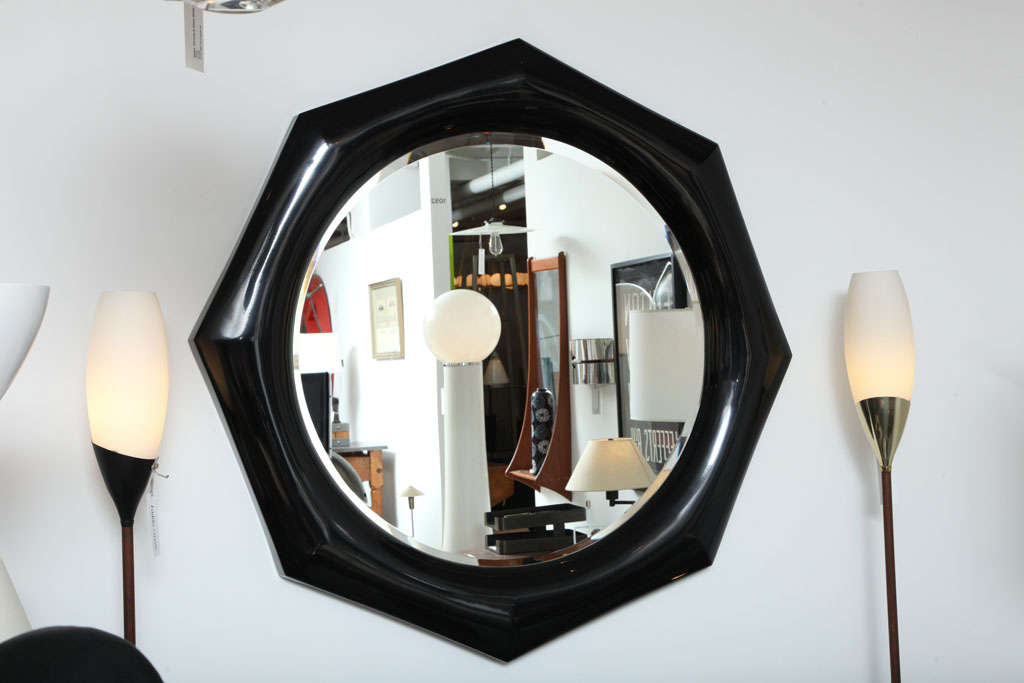 Black lacquer octagonal mirror by Marcius. USA, circa 1970.

Mirror features a black lacquer finish. Available in any custom color for an additional $750; if choosing a different color, please allow 2 weeks for delivery.

Designed and made by
