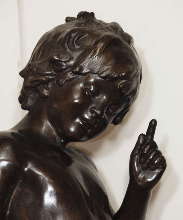 Antique French bronze figure of a boy with birds.