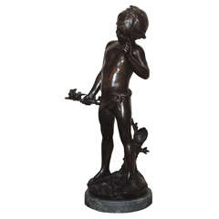 Antique French bronze figure of a boy with birds.