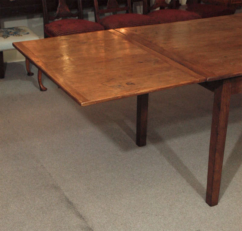 Antique French elm farm house table with  two draw leaves.