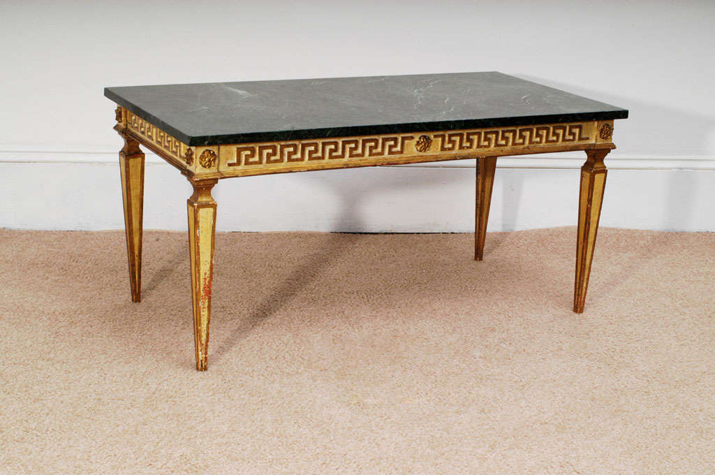 This coffee table is typical of the updated traditional that was popular right after World War II and produced by Jansen and its peers. A very "smart" look and a good size. Was $1,800; now $900.
