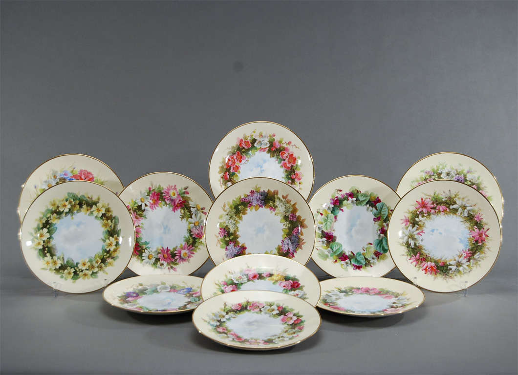 This rare and complete set of 12 Minton plates, retailed by Tiffany and Co. are all artist signed by one Minton's most repected artists, William Mussill. He specialized in the Aesthetic Movement and these are wonderful examples of his work. Each