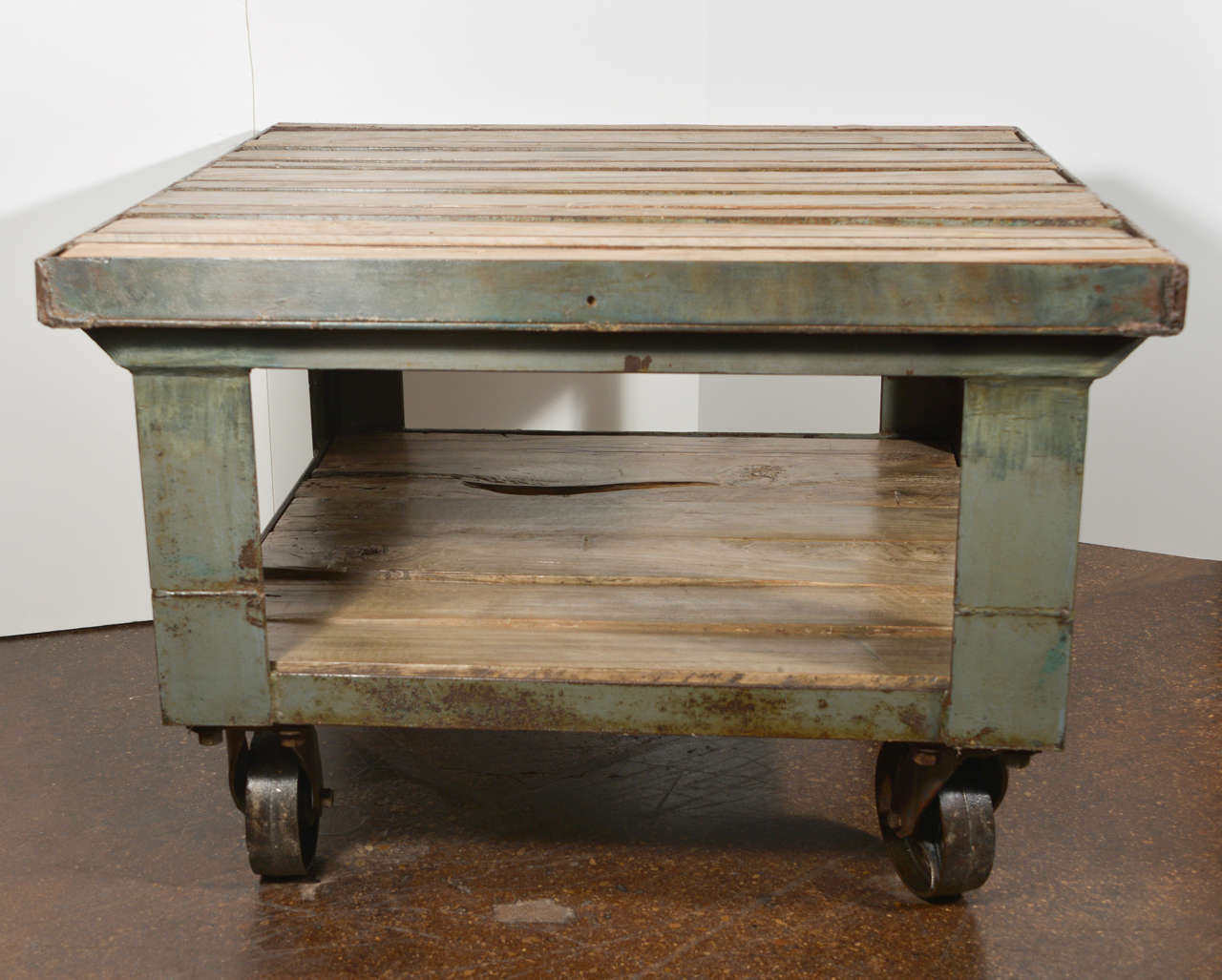Industrial cart as end table.
Steel with bleached oak slat top.