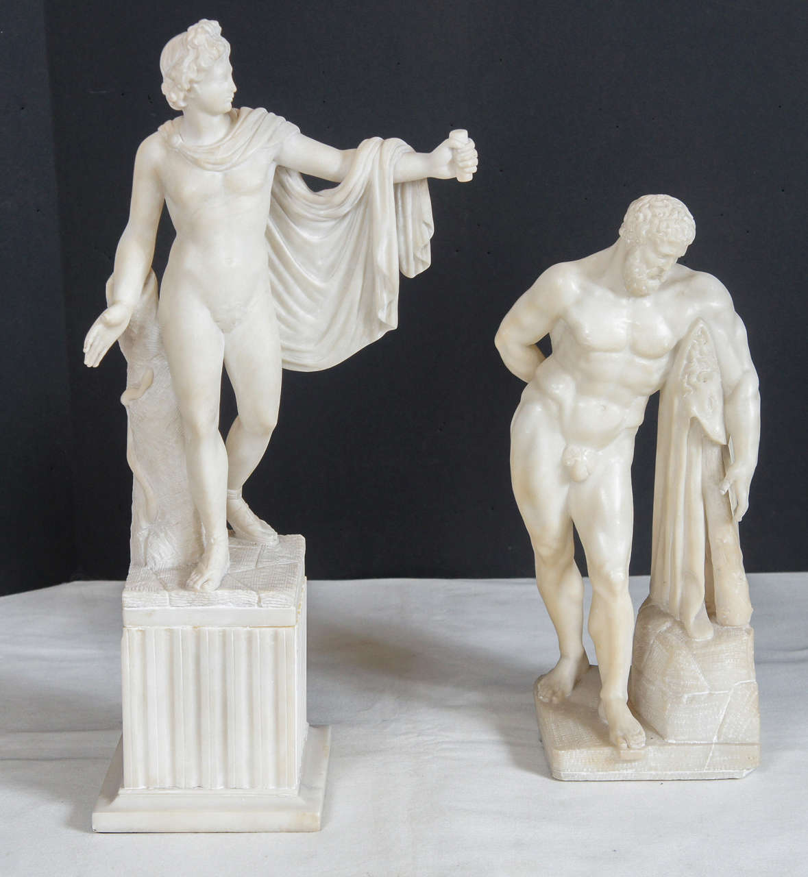 This pairing of the Apollo Belvedere & the Farnese Hercules are both grand tour collectibles created in Italy during the 19th century. Designed to sell to European  travelers furthering there education  these figures were  to represent the best that