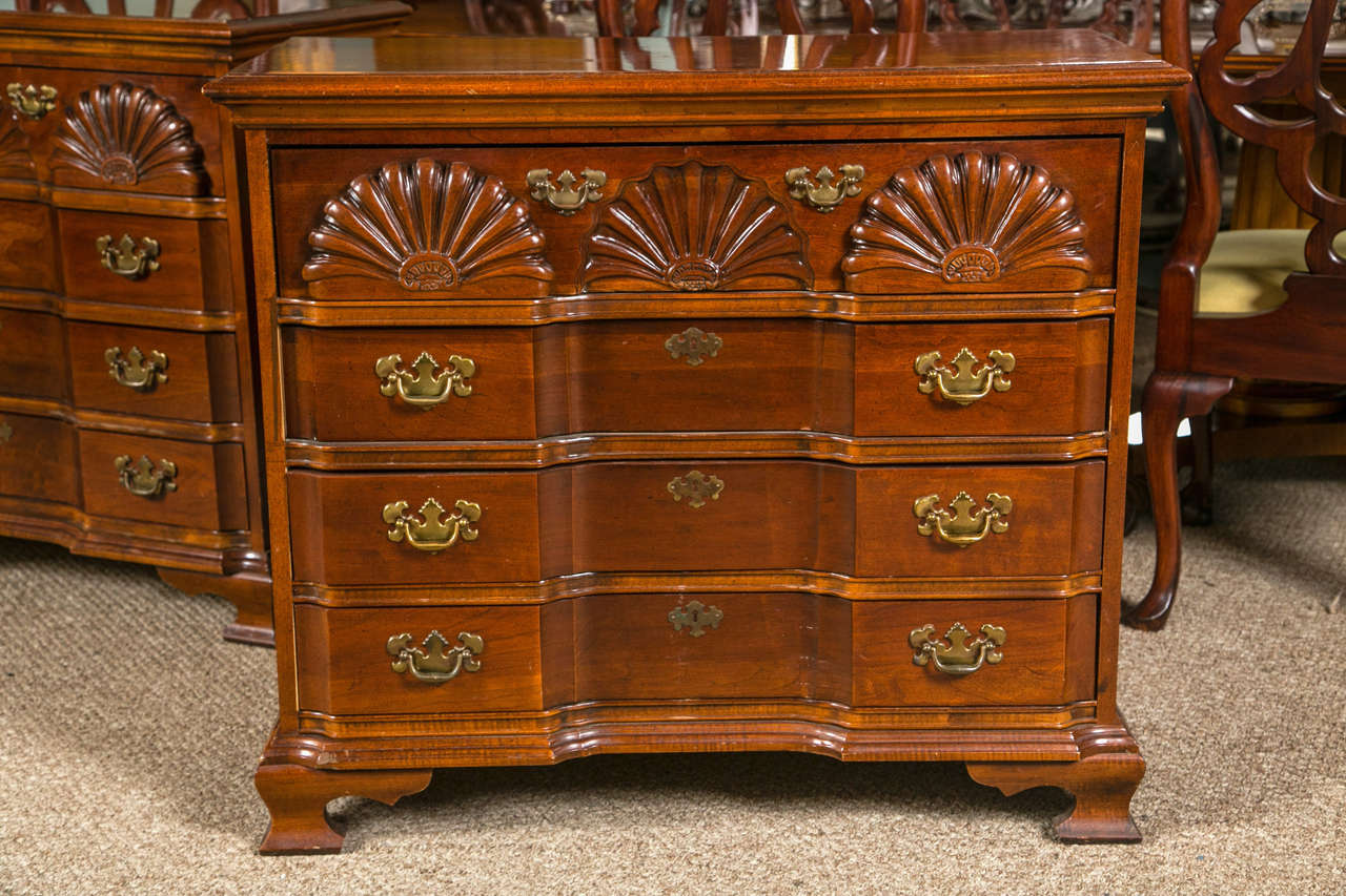 Pair of shell Chippendale style block front chests. Each custom quality, American drew, crafted chest having bracket feet supporting a four-drawer block front chest terminating in the larger shell form carved upper drawer.