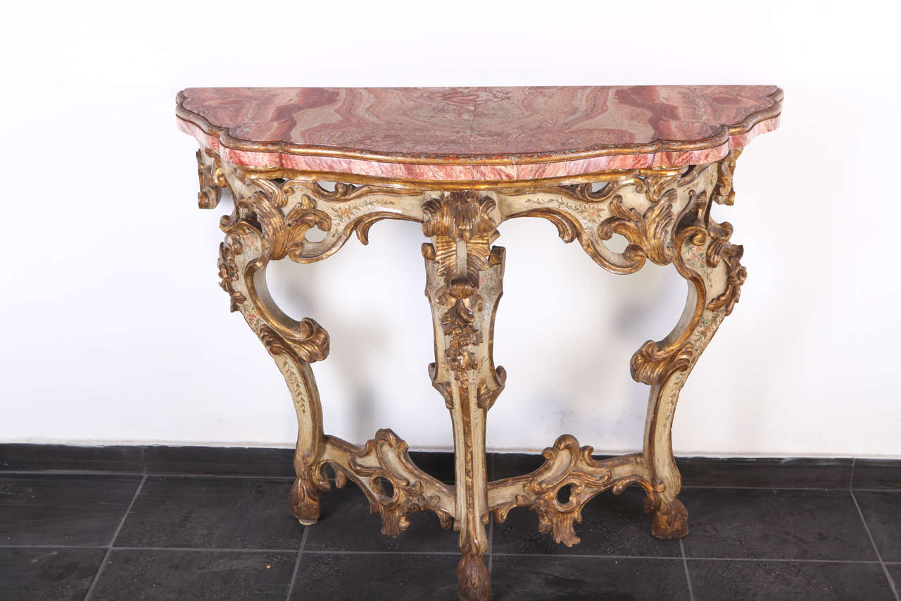 18th Century Roman giltwood and painted pair of console tables, with floral motives.