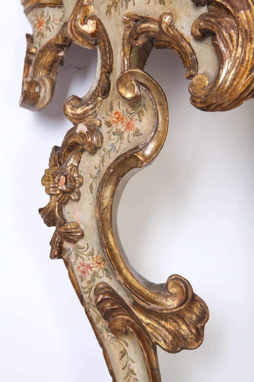 Rococo 18th Century Roman giltwood and painted pair of console tables For Sale
