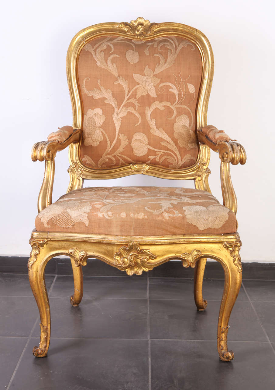 Six gilt Roman armchairs