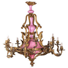 Chandelier in Gilded Bronze in Focus, and Porcelain of the 18th Century, France