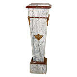 A single marble pedestal in two colors - gray and Burgundy