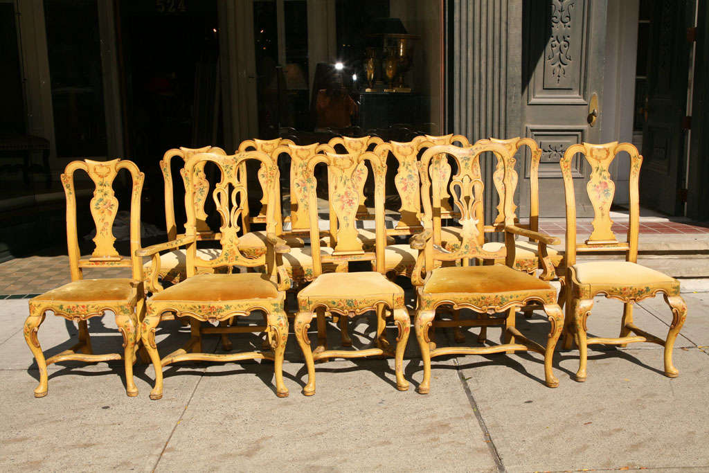 A set of Twelve Italian Paint Decorated Dining Chairs