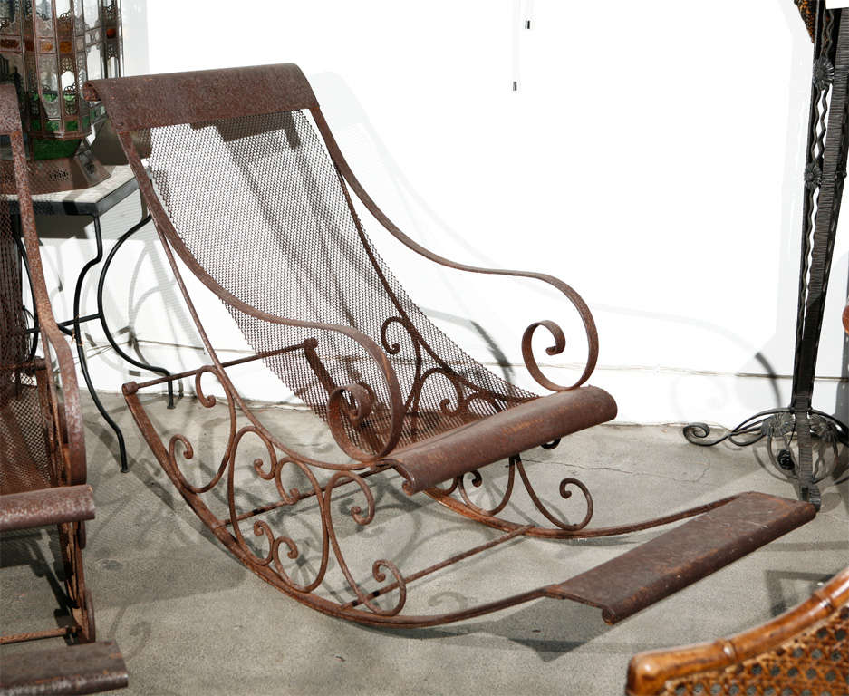 Turn of the century monumental hand forged wrought iron and mesh Rocking chairs, great to use outdoor in the garden. Amazing sculptural very large unique rockers.Probably by Italian designer,Outdoor handcrafted Iron Furniture.

Mosaik provides