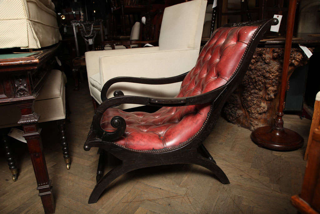 Regency period button-back leather chair.