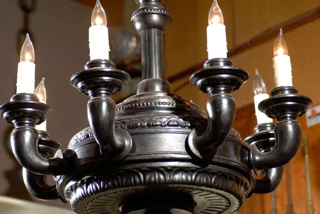 Handsome dark pewter coloured metal 8 arm chandelier in the Moorish manner with original tassel attached to the underside.Large in scale and reminiscent of the style of Bennison.
Foliate pressed designs as shown.