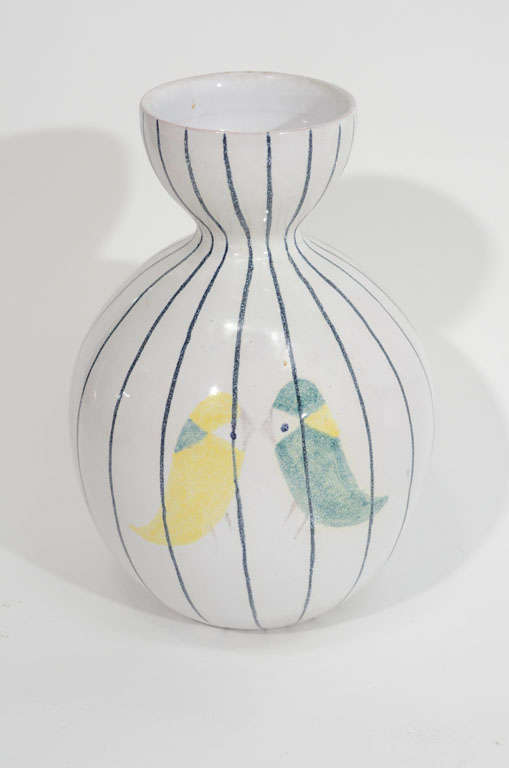 Stunning form on this Raymor vase, gently depicting two birds. The stripes add a geometric quality to this otherwise curvy piece.The vase is well marked and would look great alone or as part of a grouping.