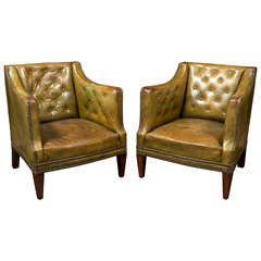 Pair of tufted leather club chairs with original leather