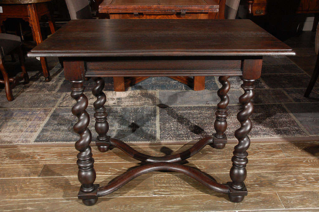 Late 19th century English barley twist end or side table. Oak side table with a straight apron above barley twist legs joined by a curved X-stretcher and raised on bun feet.