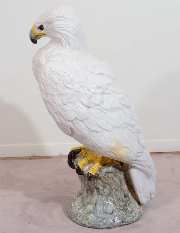 A vintage large ceramic majolica hand painted sculpture of a standing eagle.

Reduced from $1150.00