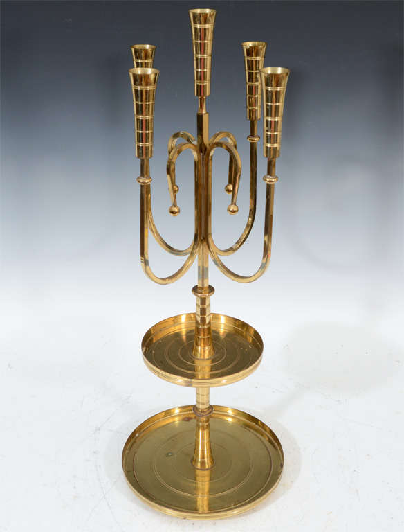 A pair of vintage Dorlyn brass candle holders by Tommi Parzinger. Each holds five candles and has two circular trays.

Reduced from: $3,950