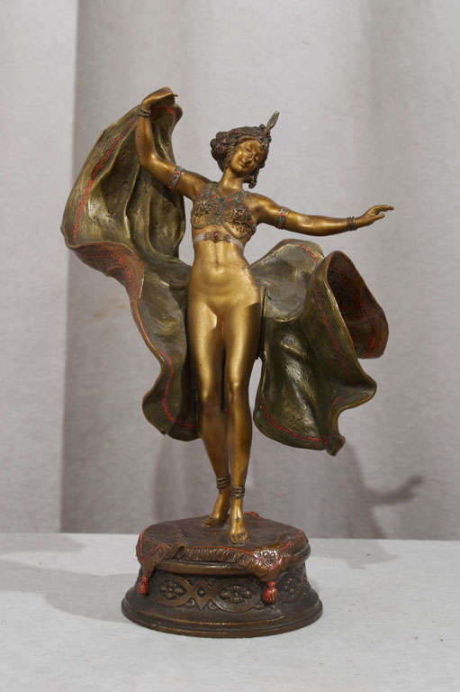 This is just a great example of one of the most collectible fields in the bronze genre.  This highly detailed, colorfully cold painted sculpture was done by the most famous maker of this style, Franz Bergmann.  This beautiful gal has a flowing