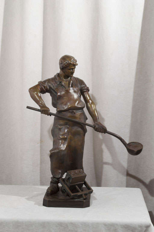 This beautifully detailed figure of a foundry worker is a warm and pleasing subject.  This very good looking gentleman is hard at work at his trade.  A beautiful example of an early 20th Century bronze.  This bronze is signed by the listed artist