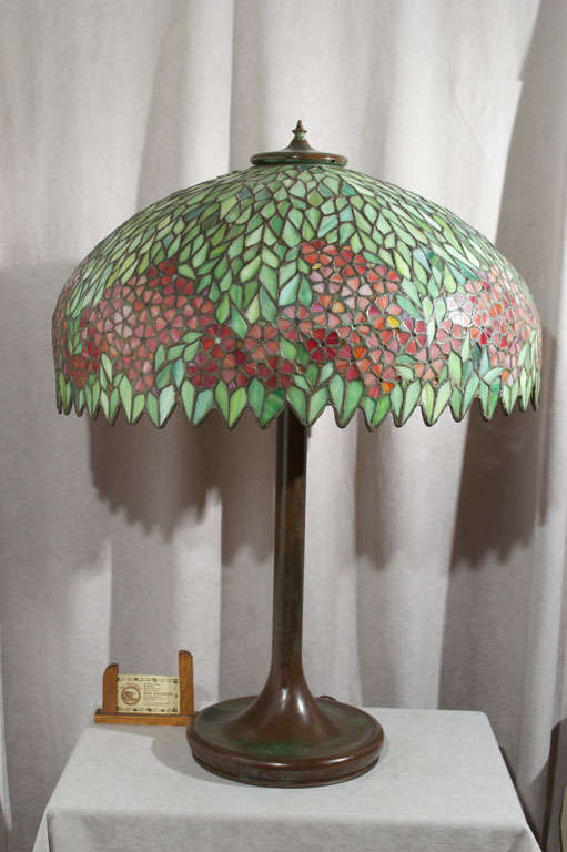 This fabulous American leaded glass table lamp by the Unique Art Glass Company, New York, is pictured on page 71 of the 