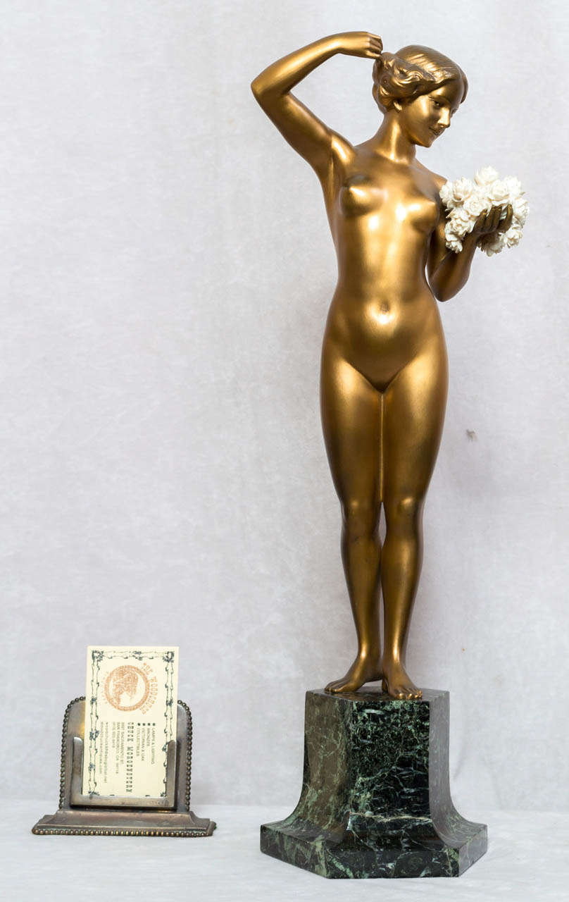 Professor Otto Poertzel, German, is one of the most highly regarded artists of the deco period.  He specialized in bronze and ivory statues and his works are highly sought after and collectible.  This beautiful young nude has that luscious gold