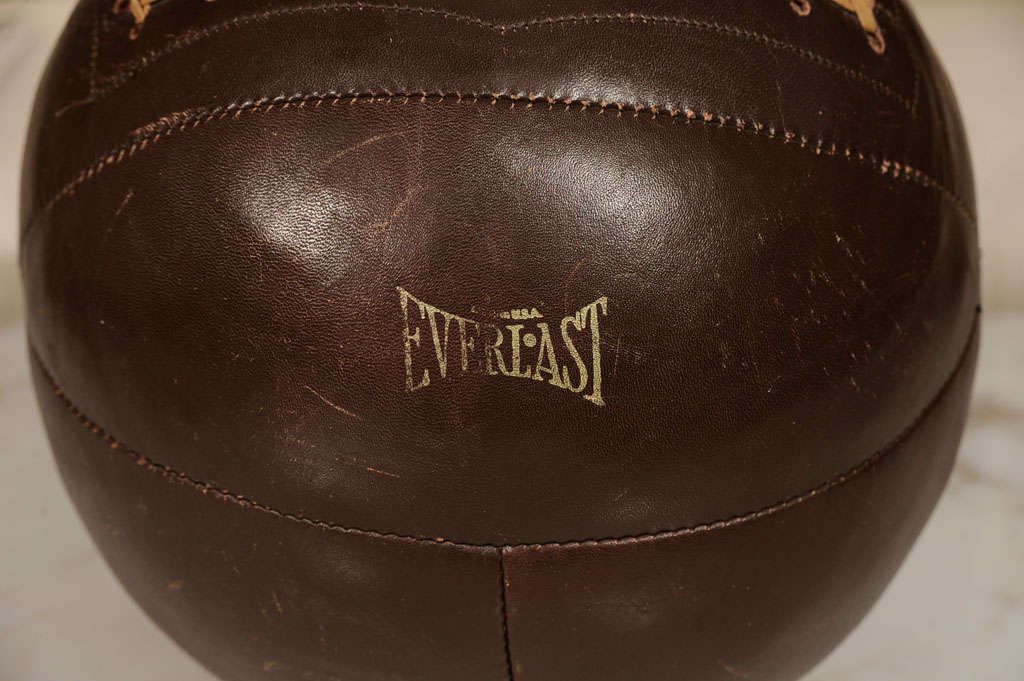 Vintage leather medicine ball by Everlast.  USA, circa 1940.<br />
<br />
Features beautiful weathered leather and original lacing.  Signed with the Everlast logo in glod lettering.<br />
<br />
Item may be viewed at our showroom at Center 44,