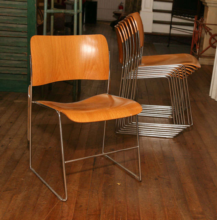 set of eight sculpted stacking chairs<br />
birch seat & back<br />
suspended on chrome frame<br />
extremely comfortable<br />
<br />
rarely found in wood<br />
<br />
model in the Louvre collection<br />
furnished St. Pauls Cathedral