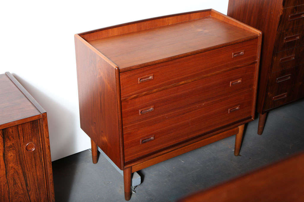Danish Modern Teak 3-Drawer Dresser with oak base and teak feet.  Top drawer opens into a writing surface and features cubbies and small shallow drawers. 33 Jay Street, Brooklyn, NY