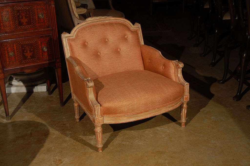 Charming, French, Marquis chair in cream and gold finish with orange linen.