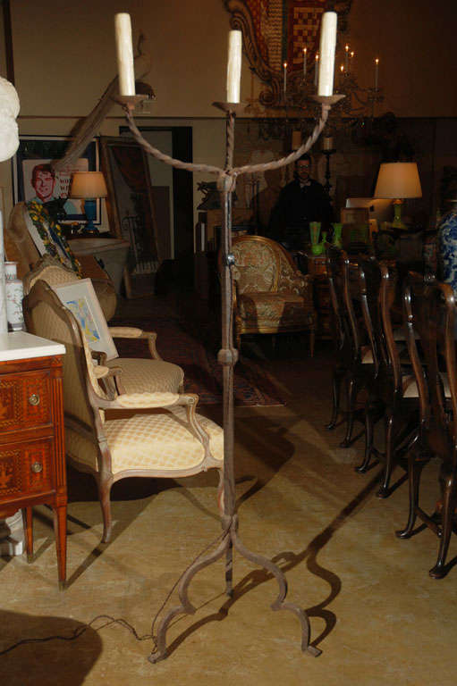 Pair of hand-forged, Florentine, three-arm, Renaissance revival candelabras wired for electricity.