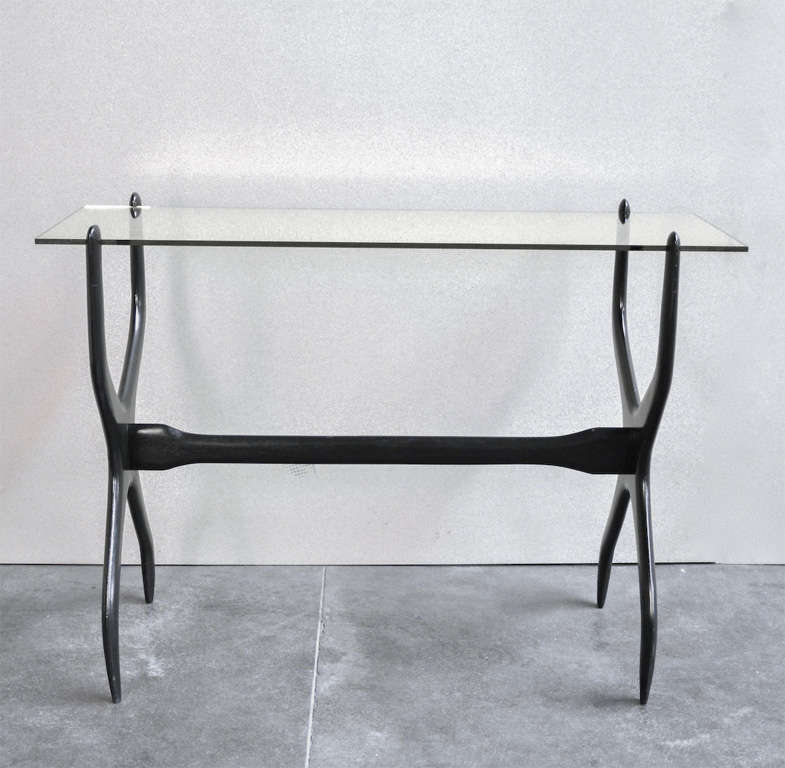 Black lacquered wood console table with a snap-fit black crystal top.