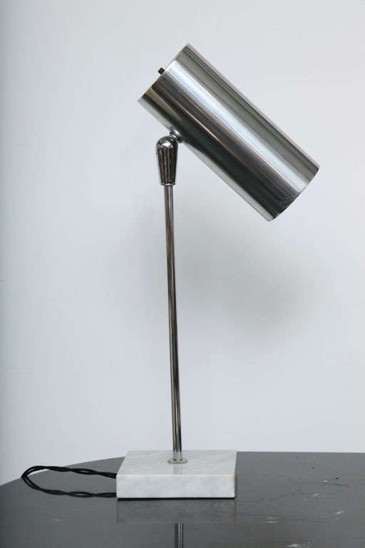 Minimalist chrome desk lamp with adjustable shade and square marble base.  USA, circa 1950.