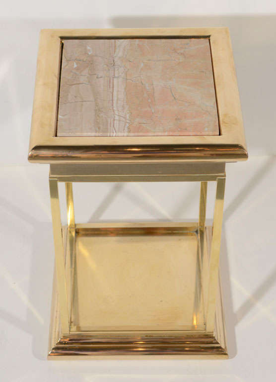 Modern side table or pedestal with two tier design, made of brass with exotic marble top inset. The table has a squared column or plinth form with stepped base detail and thick top tier design. Makes an excellent drinks table or can be used as a