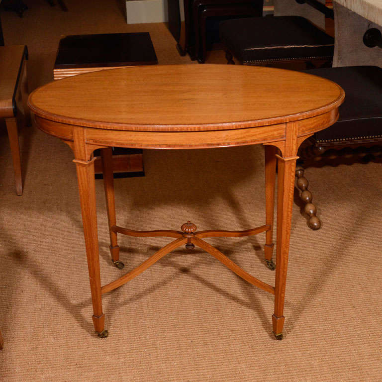 An Edwardian Neo-Classical Satinwood Oval Center Table