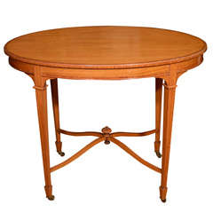 Antique An Edwardian Neo-Classical Satinwood Oval Center Table