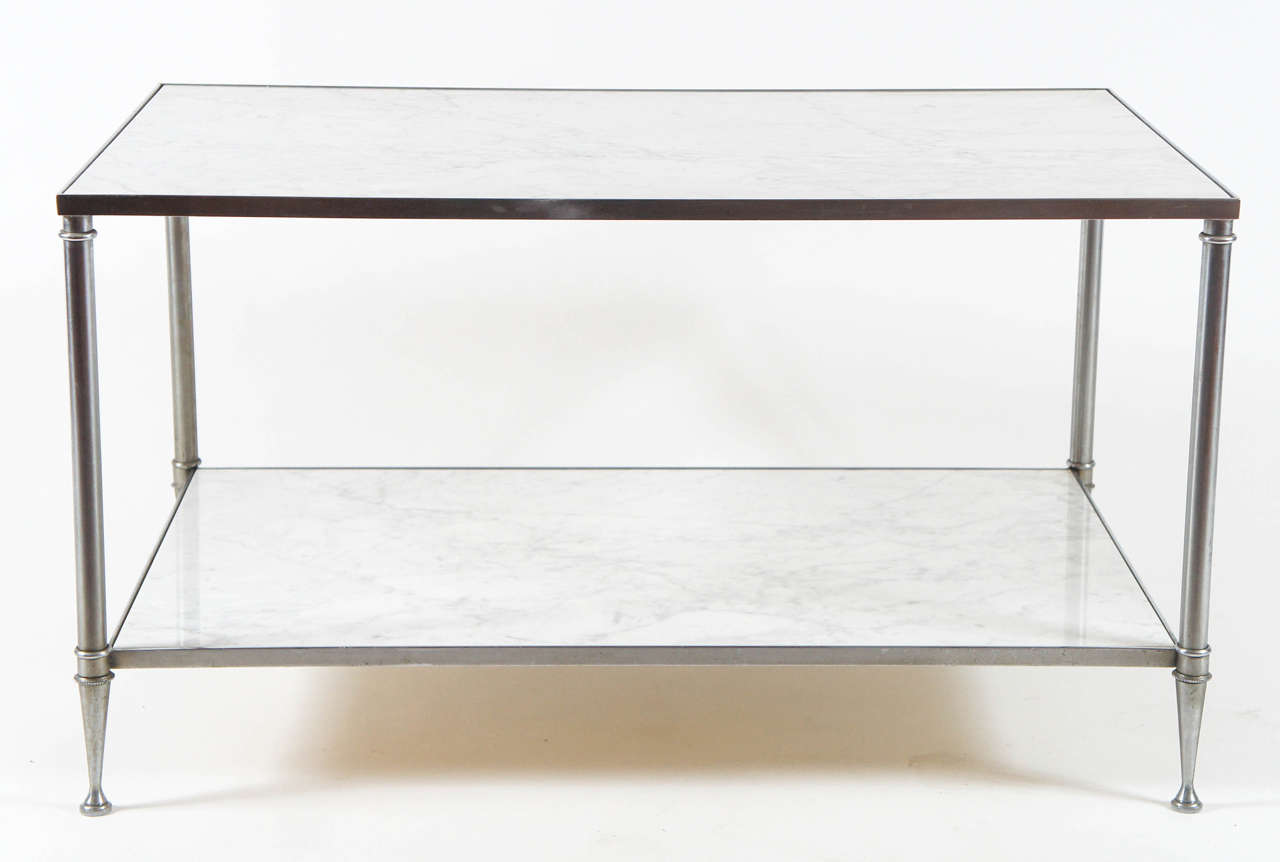 Elegant vintage circa 1960 low table attributed to Maison Jansen having two tiers of grey-veined Carrara marble in polished steel frame.