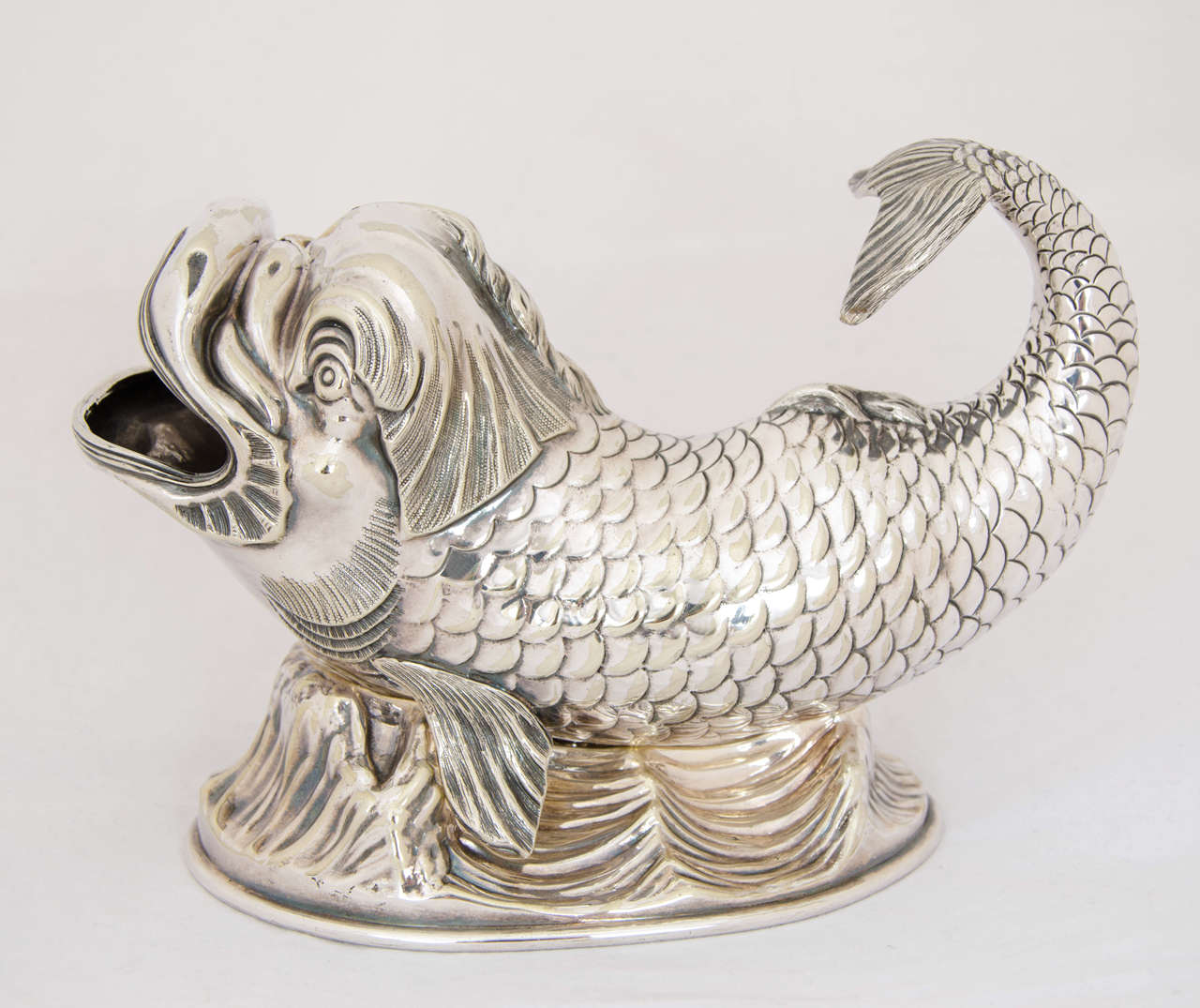 A delightful Silver-plated Spoon Warmer in the form of a fish, circa 1890
Made by James Dixon & Son.
Length is 21cms.