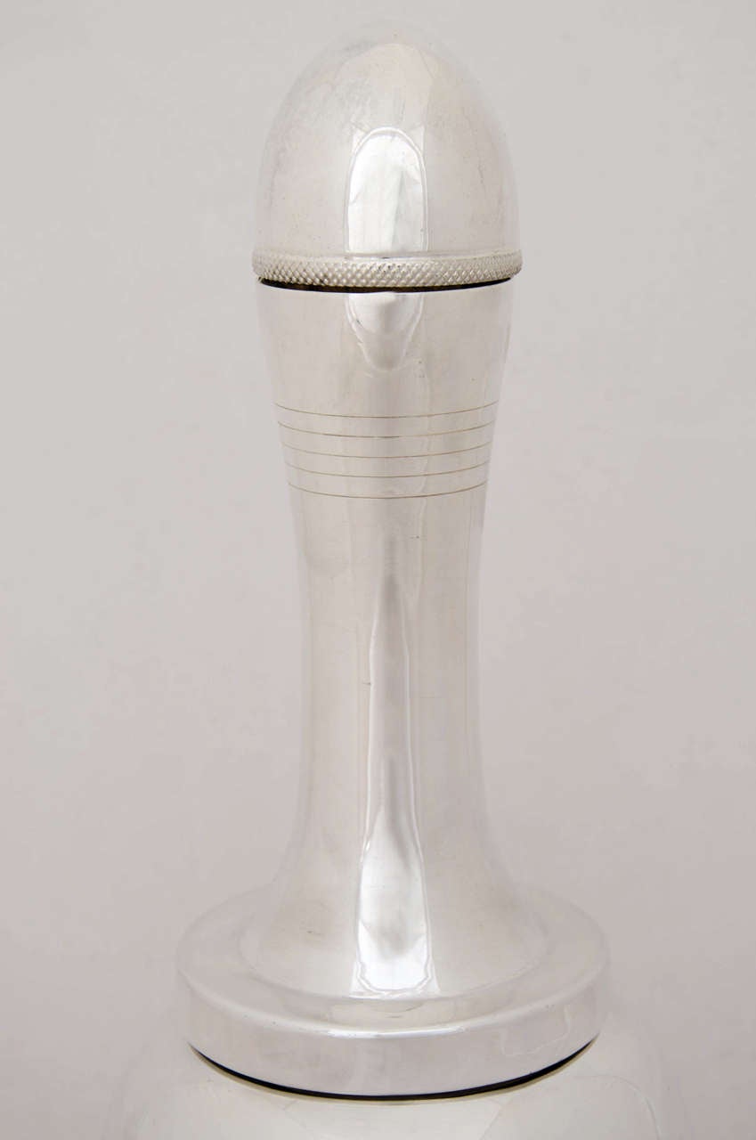 A silver-plated "Bell" cocktail shaker, retailed by Asprey, circa 1940.
Height is 27.5cms.