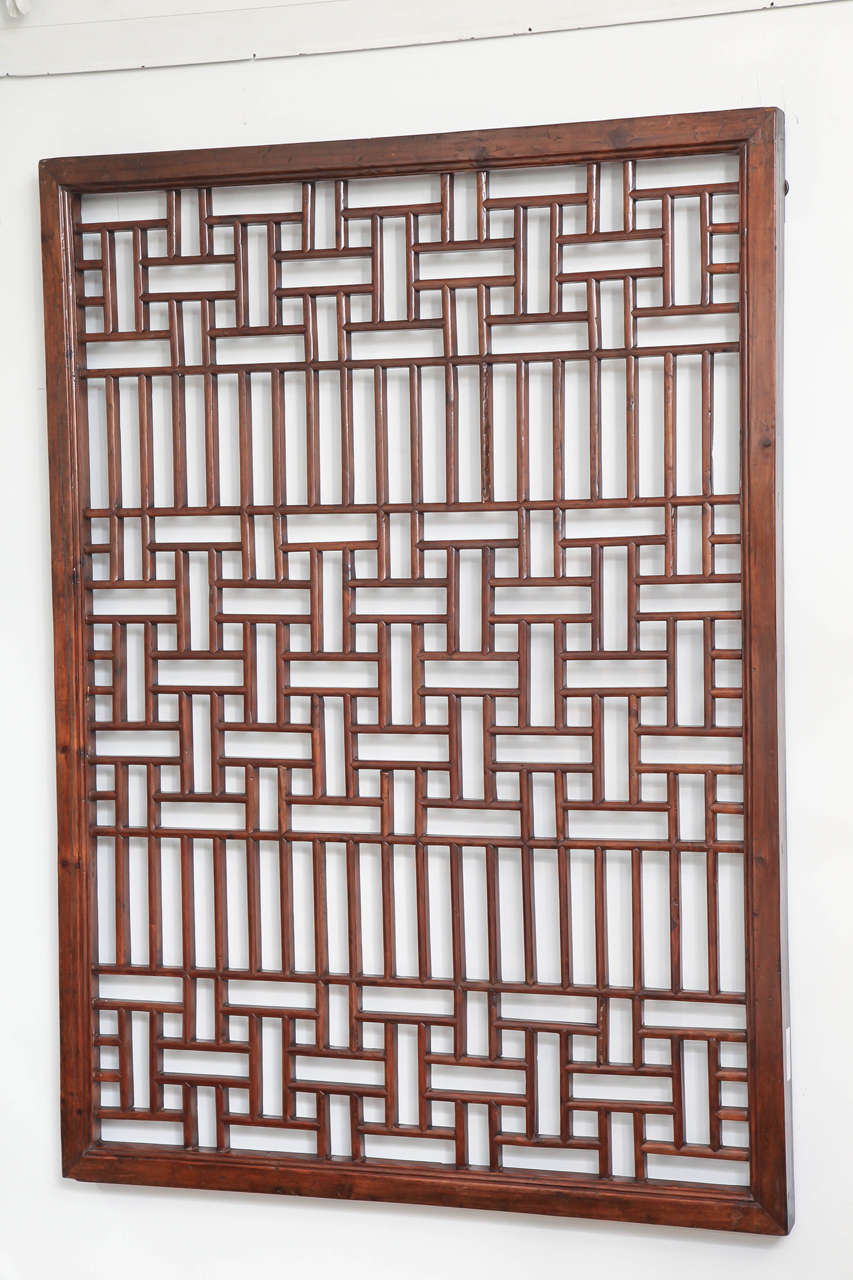 A carved lattice screen panel from Zhejiang, China, late 19th century. Suitable for mirror backing.