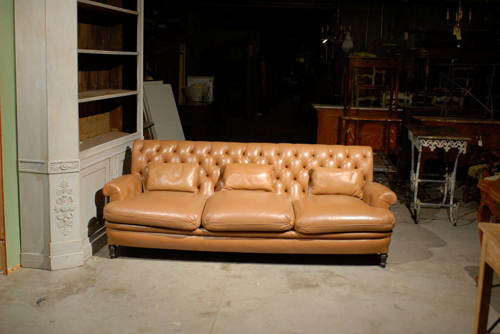 the Pair Vintage Three Seat Chesterfield Sofas by Mechichein  in tan leather  are  soft and supple with classic tufting. The design details are  augmented by three ingenious lumbar cushions atop each marvelously zaftig seat cushion.