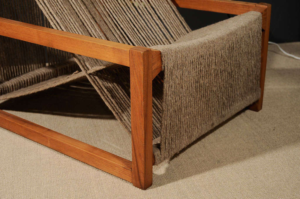 A geometrically-intriguing lounge chair comprising a solid walnut frame wrapped over with jute cords. Known as the 