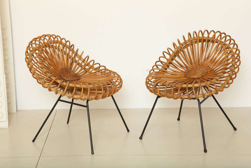 A rare pair of rattan chairs by Abraham and Rol, Edition Rougier and S.I.R., designed in 1957. Please note that the back is very low on these chairs.