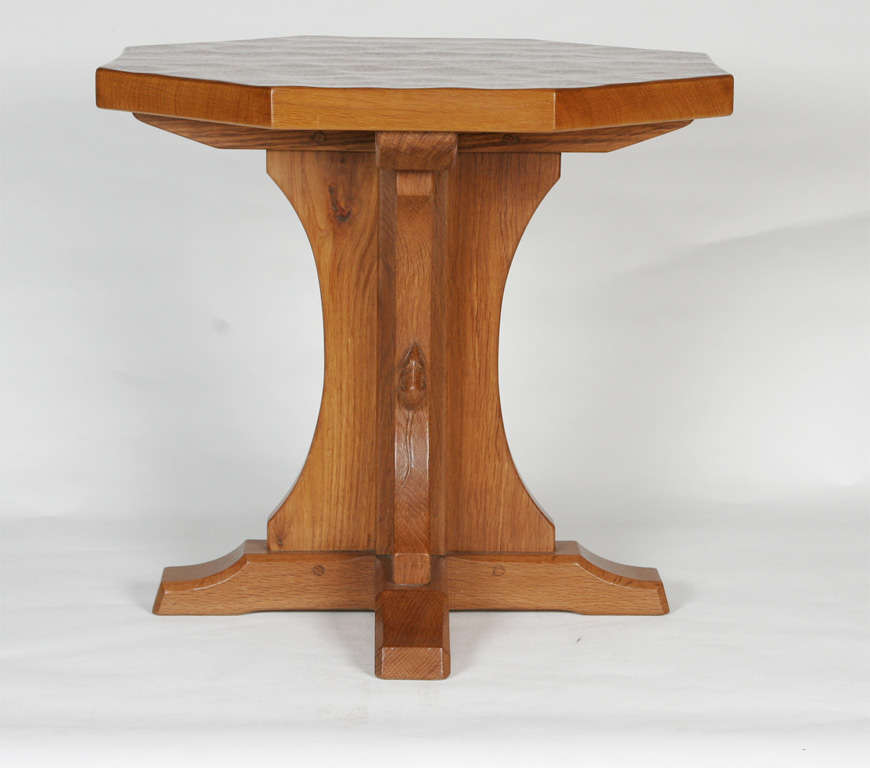 A Robert “Mouseman” Thompson Oak octagonal occasional Table.<br />
On cruciform base.<br />
Carved Mouse signature.