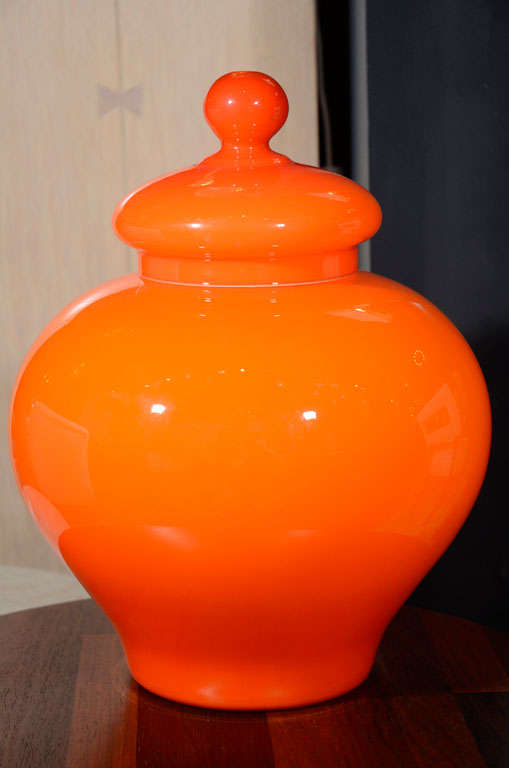 A decorative, cased glass ginger jar in a lively 