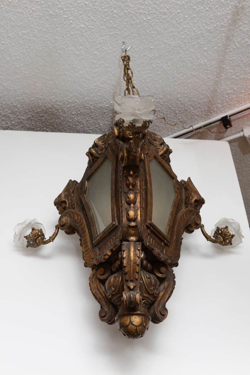 Venetian lantern which is hand-carved and gilded with putti motif, three candle arms with frosted floral shades plus interior light. Original restored finish.

Originally $ 9,750.00

CHECK OUT OUR WED SITE FOR ADDITIONAL SPECIALS