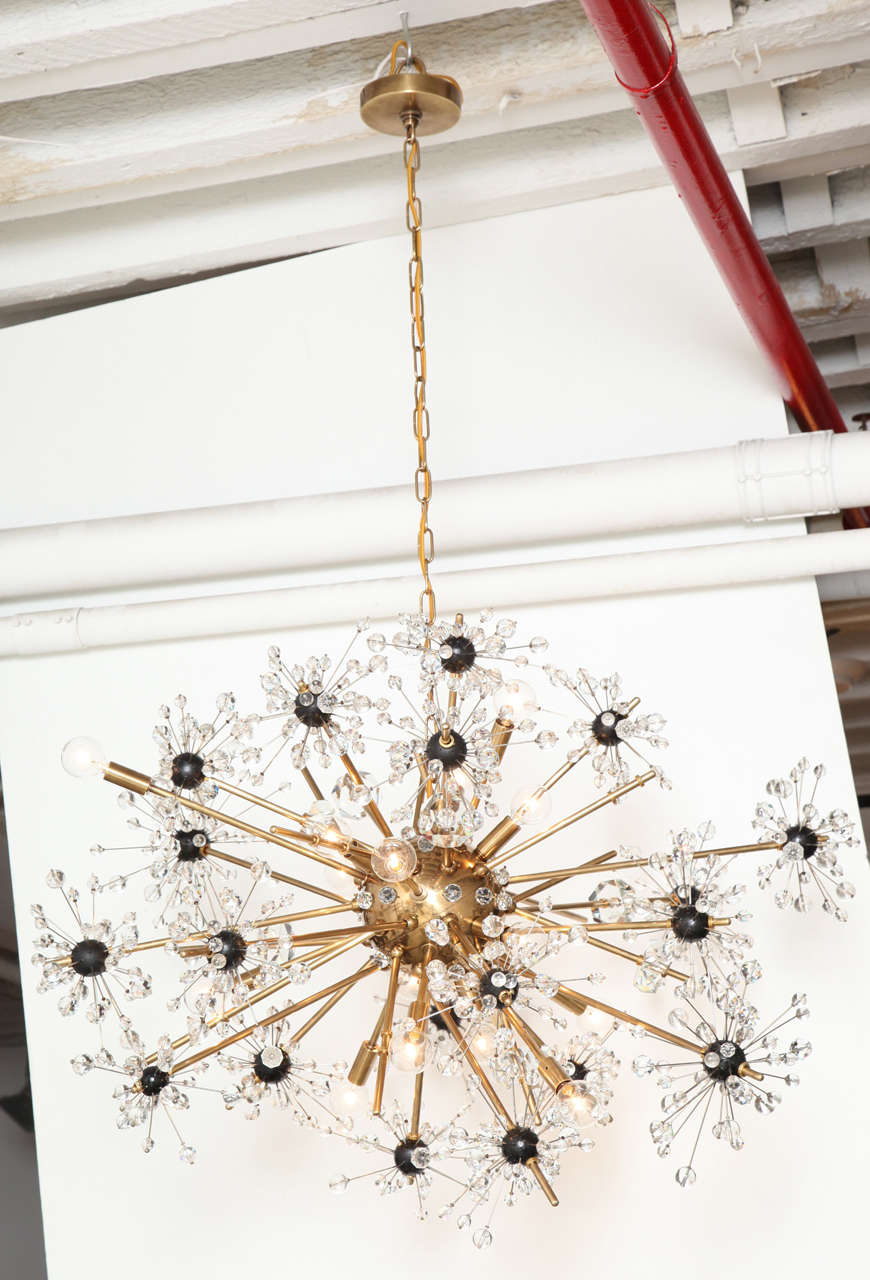 16 light Lobmeyr Metropolitan chandelier in brass with hand cut crystals and glass designed by Hans Harold Rath for the Metropolitan Opera House in New York in 1963.