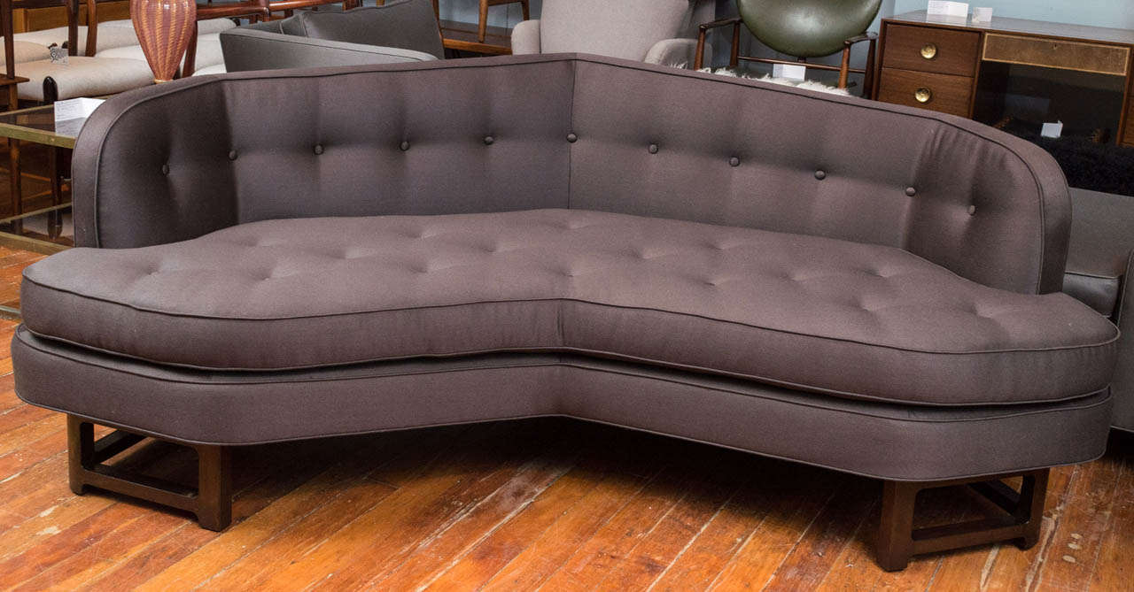 Outstanding Dunbar tufted sofa designed by Edward Wormley for their Janus line. Expertly refurbished with new foam, sateen wool upholstery and refinished walnut base.

**Please contact us directly if you are interested in pricing / shipping